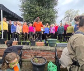 Ashtones Community Choir performing Ain't Gonna in Ashton Park Preston